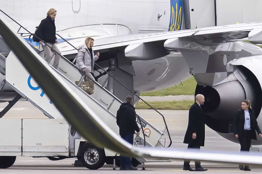 First lady of Ukraine Olena Zelenska, second left, arrives at the airport in Zurich (Michael Buholzer/Keystone via AP)