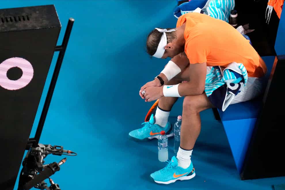 Rafael Nadal hangs his head after suffering an apparent hip injury (Dita Alangkara/AP)