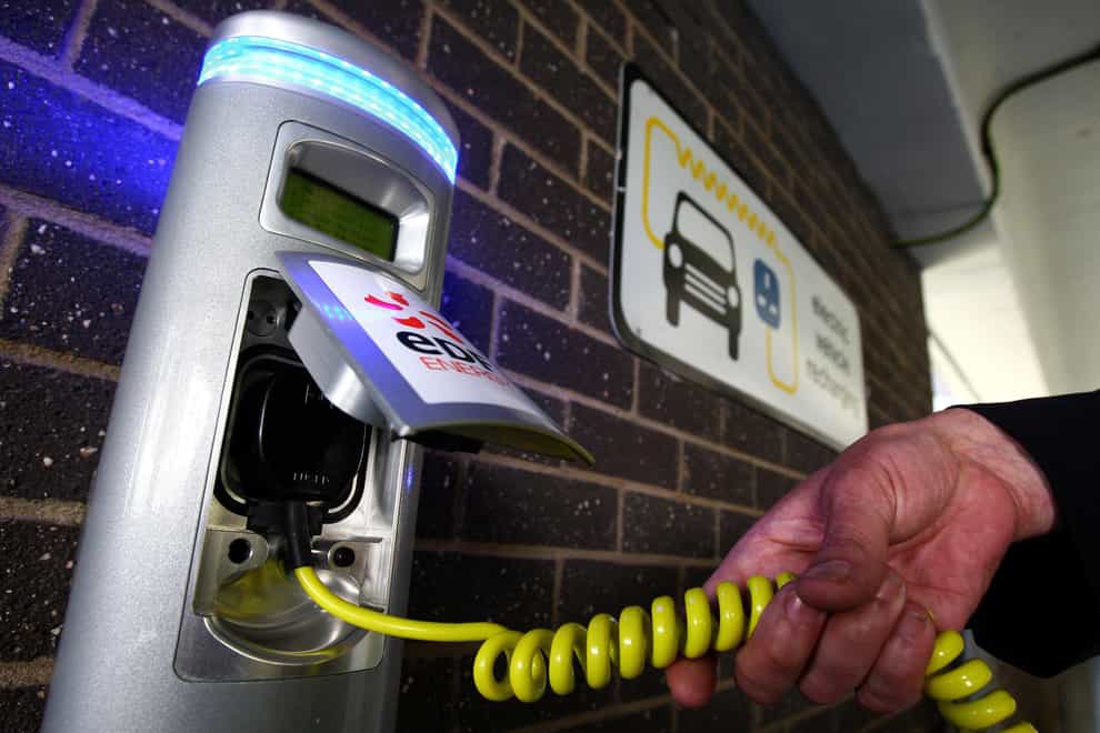 An electric car being charged (Andrew Milligan/PA)