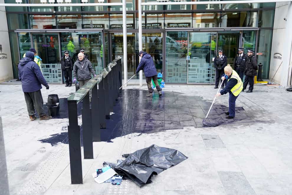 Black paint on the pavement outside the Home Office and the Department of Levelling Up, Housing & Communities in London, following a protest by members of Extinction Rebellion. Picture date: Wednesday January 18, 2023.