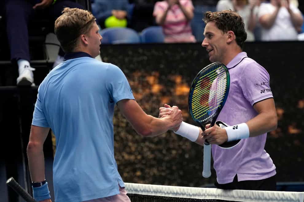 Jenson Brooksby, left, stunned second seed Casper Ruud, right, at the Australian Open (Dita Alangkara/AP)