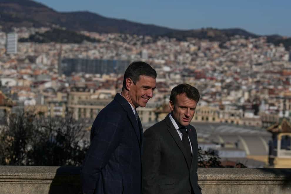 French President Emmanuel Macron, right, talks with Spanish counterpart Pedro Sanchez in Barcelona (Emilio Morenatti/AP)