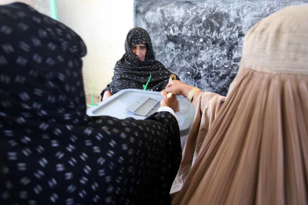 Afghan women voting (Lewis Whyld/PA)