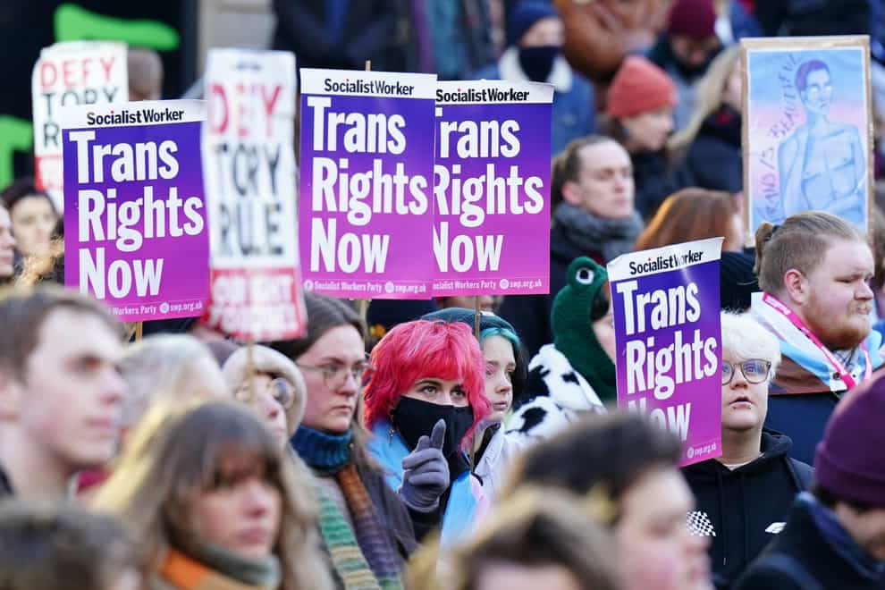 People take part in a demonstration for trans rights outside a UK Government office in Edinburgh (Jane Barlow/PA)
