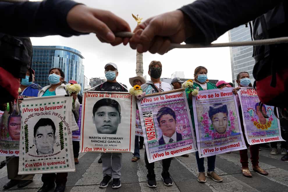 Relatives and classmates of the missing 43 Ayotzinapa college students, march in Mexico City in 2022, on the anniversary of their disappearance in Iguala, Guerrero state (Marco Ugarte/AP/PA)
