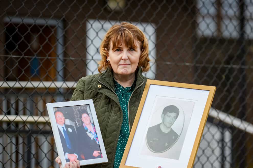 Bernadette McKearney, widow of Kevin McKearney, holding an image of her husband and her parents Charlie and Tess Fox outside Craigavon Court, Co Armagh, during the inquest into the 1992 deaths of Kevin McKearney, Jack McKearney, Charles Fox and Teresa Fox. Picture date: Monday January 23, 2023.