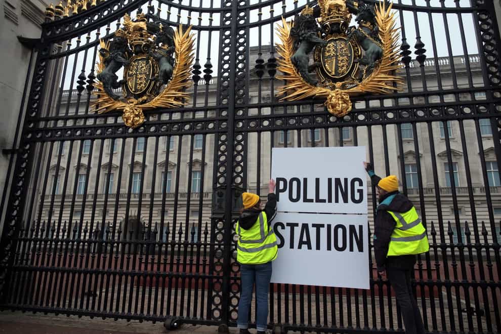 Activists from Republic put a polling station sign on the gates of Buckingham Palace (Rikki Blue/Republic/PA)