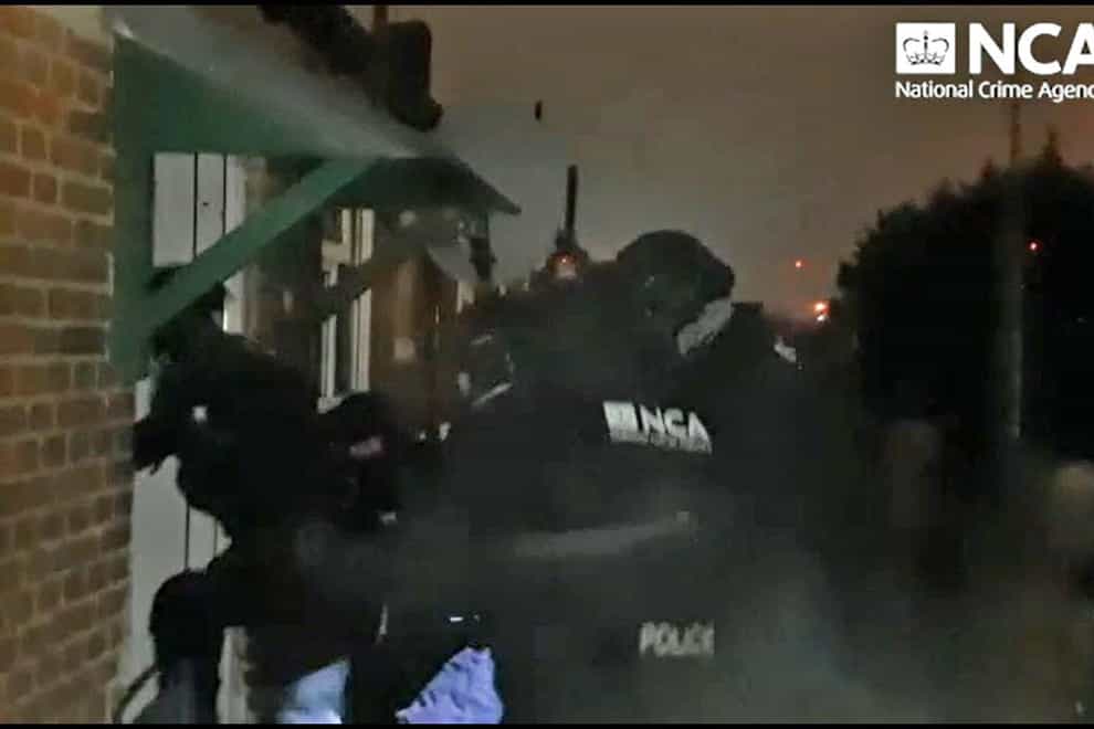 A raid on one of several addresses in London by the NCA (National Crime Agency/PA)
