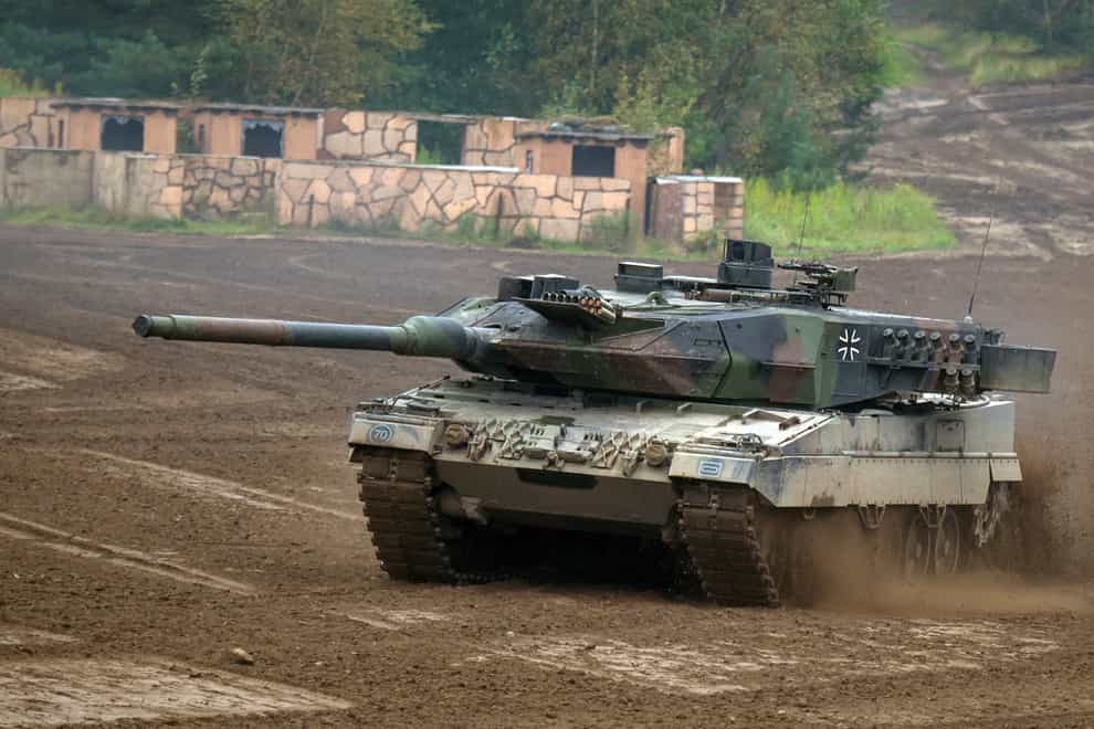 A Leopard 2A6 main battle tank drives across a training area in Munster, Germany (Philipp Schulze/dpa via AP, file)