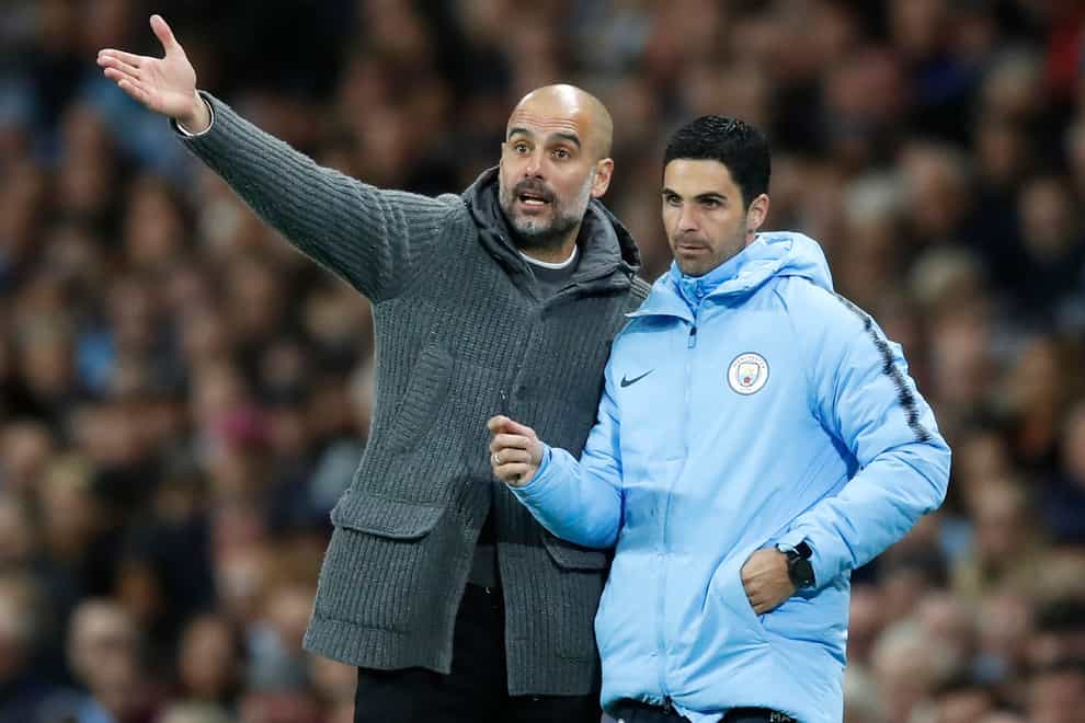 Pep Guardiola (left) and former assistant Mikel Arteta face each other this week (Martin Rickett/PA)