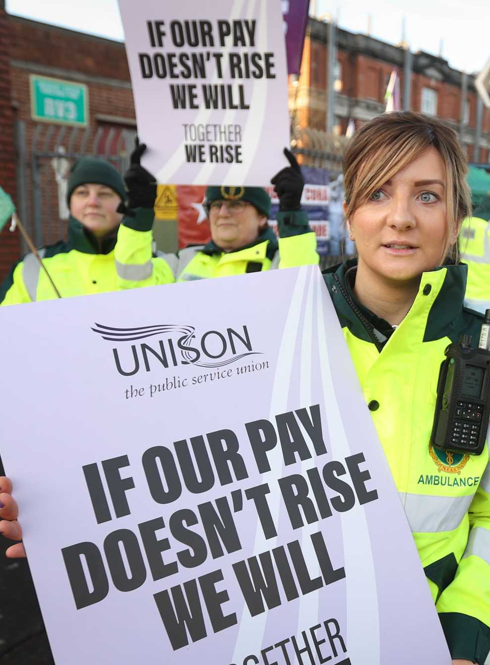 Kate McKeague, an ambulance care assistant, joins her colleagues on the picket line outside the Royal Victoria Hospital in Belfast (Liam McBurney/PA)