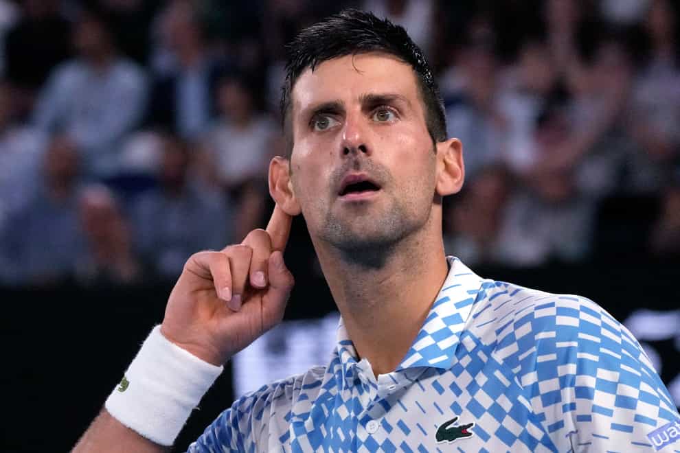 Novak Djokovic gestures to the crowd after winning the first set (Aaron Favila/AP)