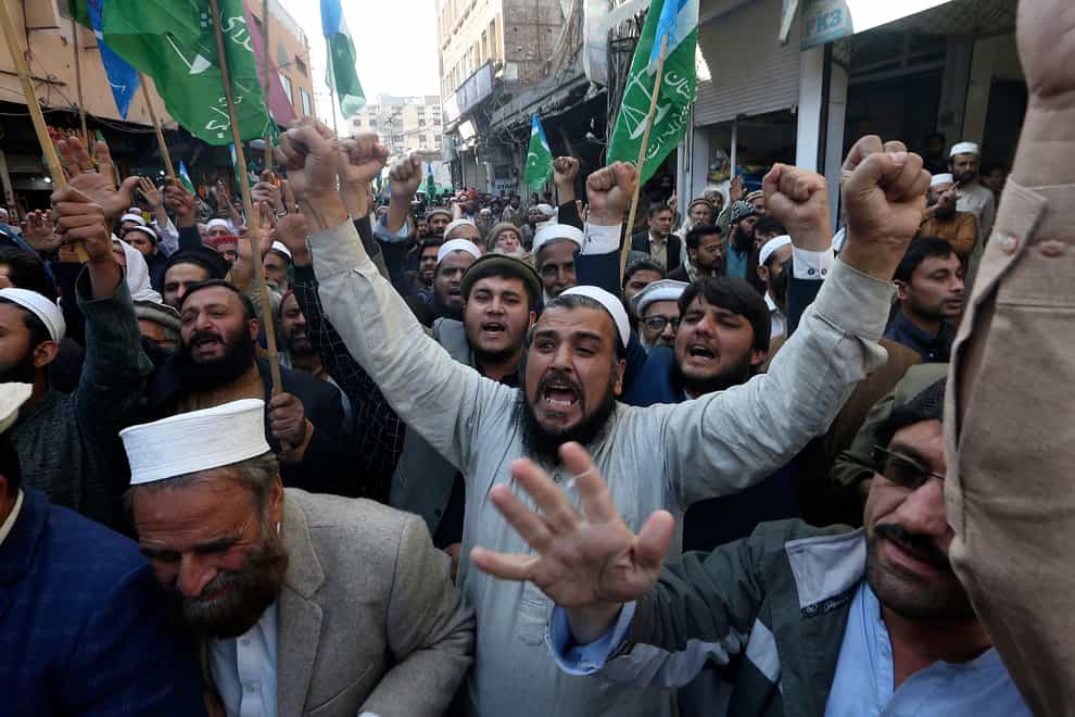 Supporters of Jamaat-e-Islami chant slogans during a protest in Peshawar, Pakistan, against the burning of the Koran, a Muslim holy book, by a Danish anti-islam activist (Muhammad Sajjad/AP)