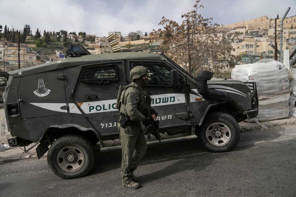 An Israeli policeman secures a shooting attack site in east Jerusalem (Mahmoud Illean/AP)
