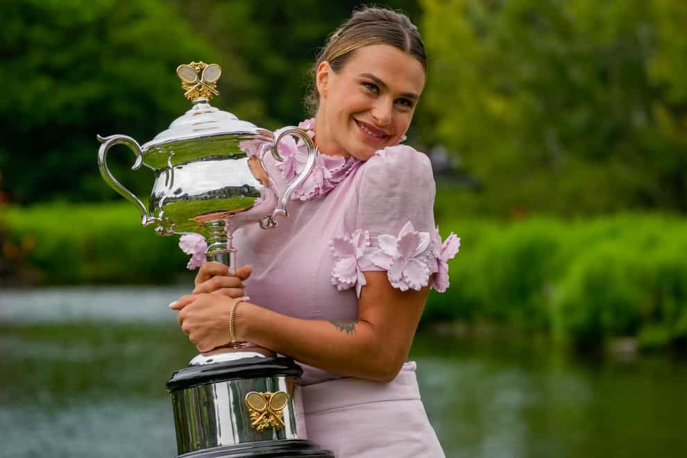 Aryna Sabalenka poses with the Daphne Akhurst Memorial Cup on Sunday (Aaron Favila/AP)