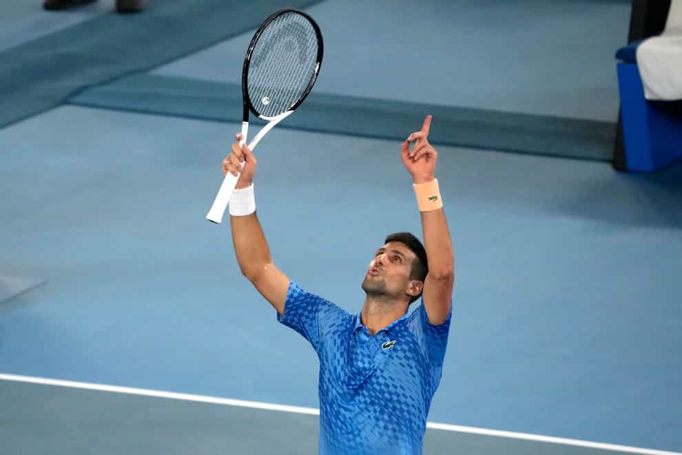 Novak Djokovic celebrates beating Stefanos Tsitsipas to win his 10th Australian Open title and his 22nd Grand Slam (Mark Baker/AP)