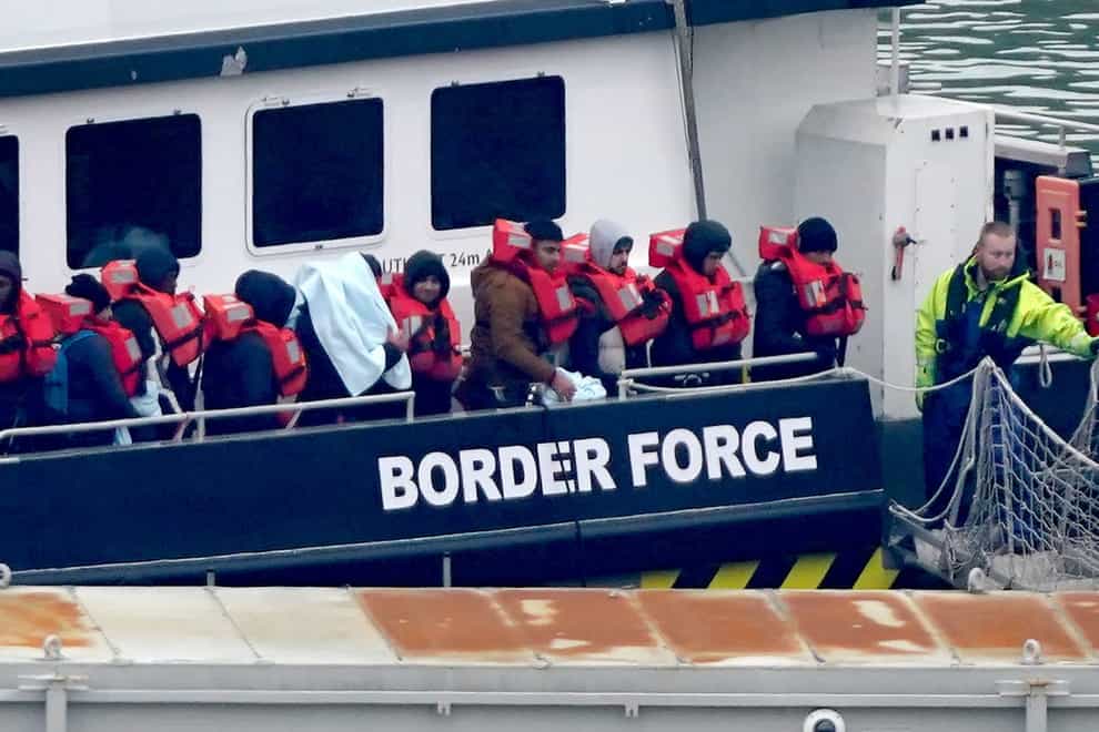 A group of people thought to be migrants being brought to Dover, Kent, on a Border Force vessel following a small boat incident in the Channel (PA)