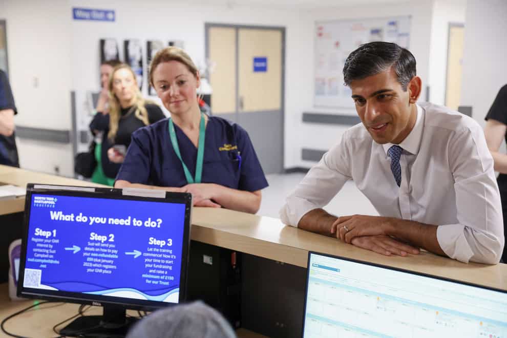 Prime Minister Rishi Sunak speaking to a staff member during his tour of University Hospital of North Tees, as part of his visit to County Durham (Phil Noble/PA)
