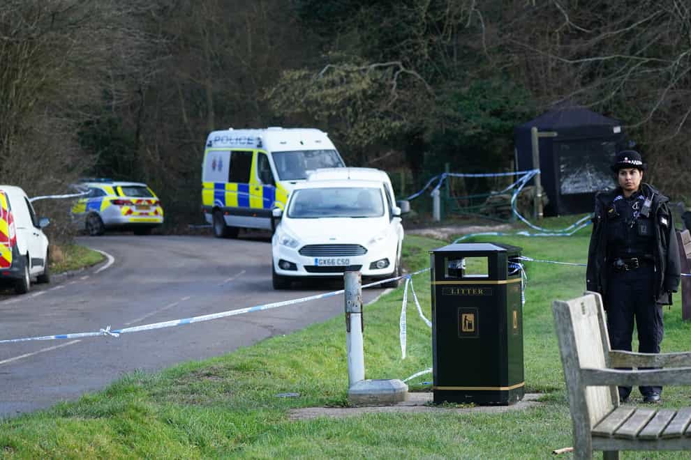 Police at the scene at Gravelly Hill in Caterham, Surrey (PA)