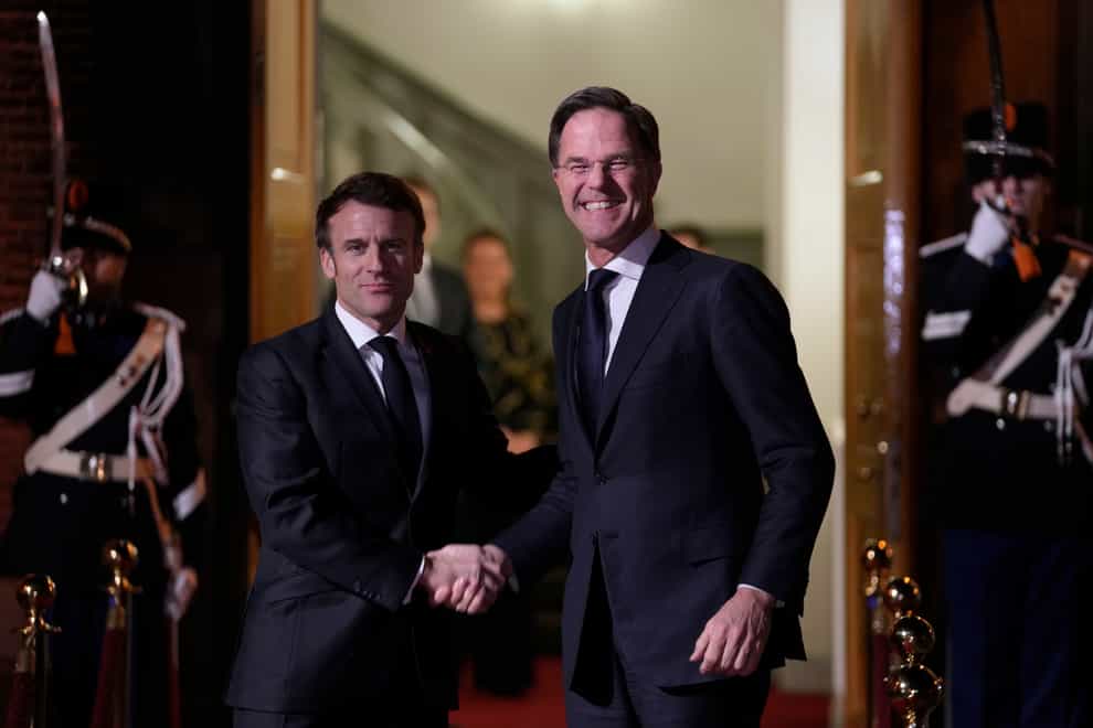 French President Emmanuel Macron, left, and Dutch Prime Minister Mark Rutte meet in The Hague, Netherlands (Peter Dejong/AP)