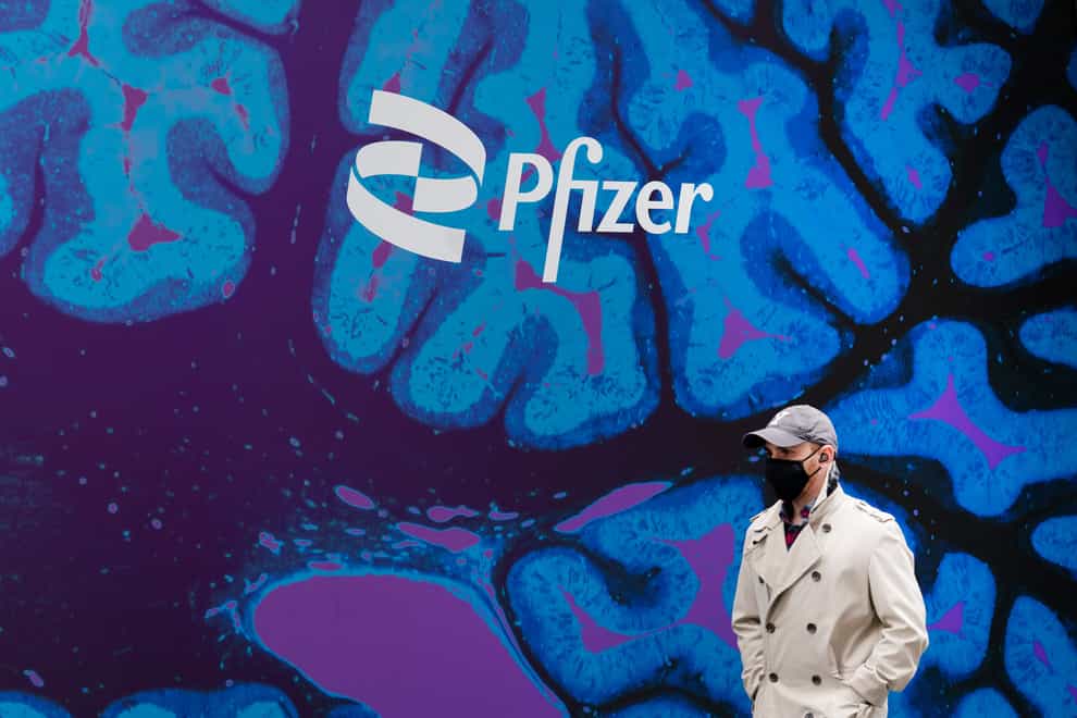 Covid-19 booster vaccines and treatments for coronavirus helped push Pfizer to a better-than-expected final quarter of 2022 (Mark Lennihan/AP)