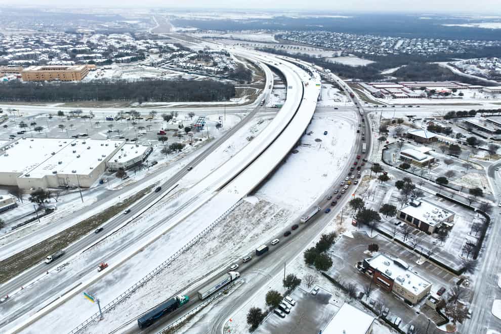 An icy mix covers Highway 114 in Roanoke, Texas (Lola Gomez/The Dallas Morning News/AP)