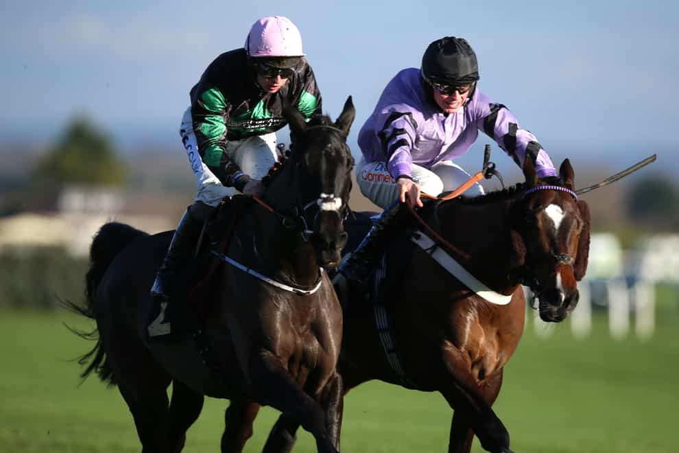 Strong Leader ridden by jockey Sean Bowen (left) on their way to winning the Boylesports Best Odds Guaranteed Novices’ Hurdle (Qualifier) with Jaramillo ridden by jockey James Bowen third during Boylesports Becher Chase Day at Aintree Racecourse, Merseyside (Nigel French/PA)