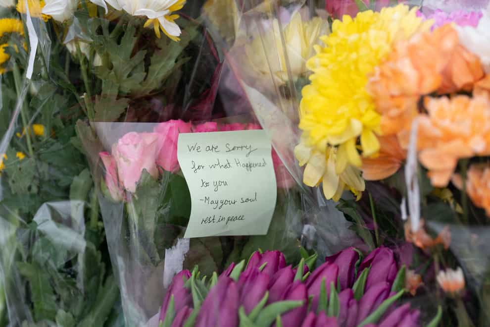 Flowers have been laid near the house where a four-year-old girl died (Joe Giddens/PA)