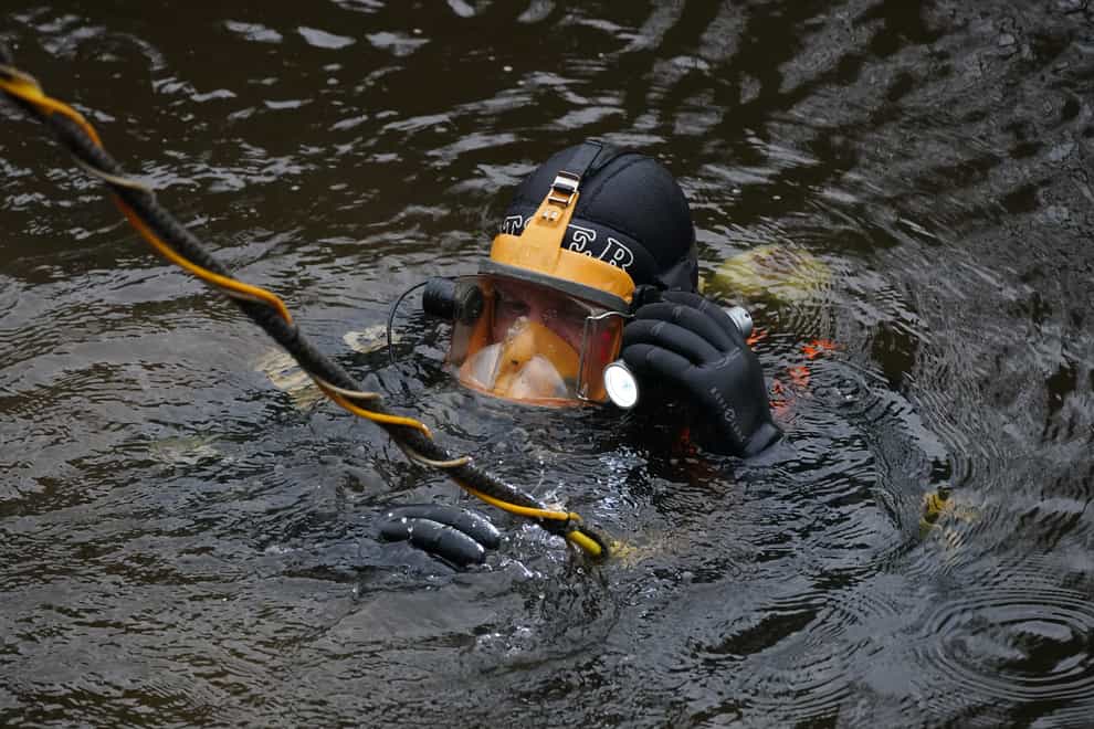 A diver searches in the River Wyre, in St Michael’s on Wyre, Lancashire (Peter Byrne/PA)