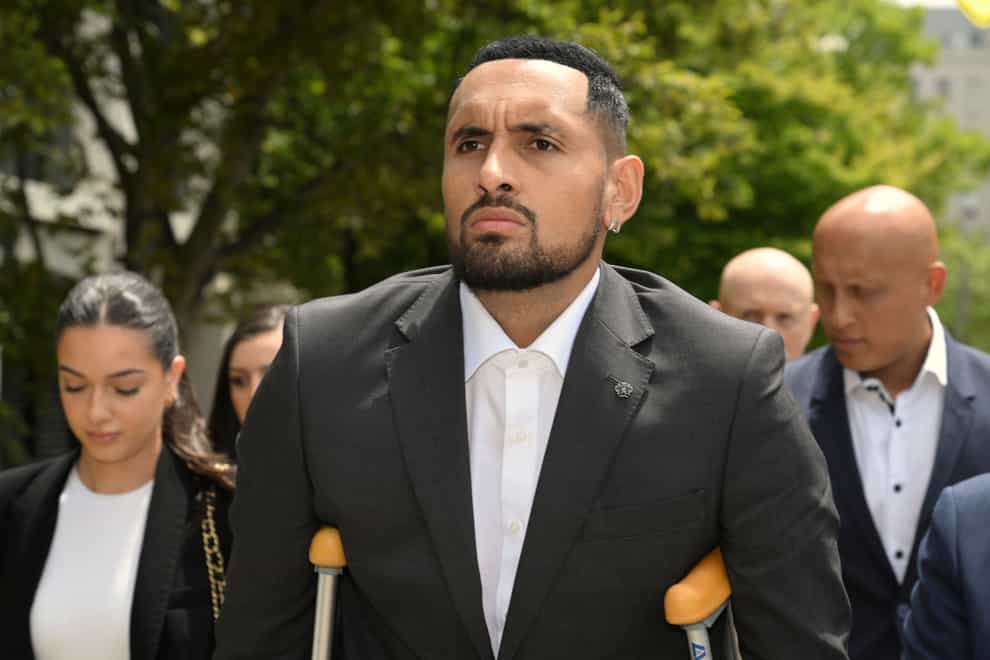 Australian tennis player Nick Kyrgios arrives on crutches at the ACT Magistrates Court in Canberra (Mick Tsikas/AAP Image via AP)