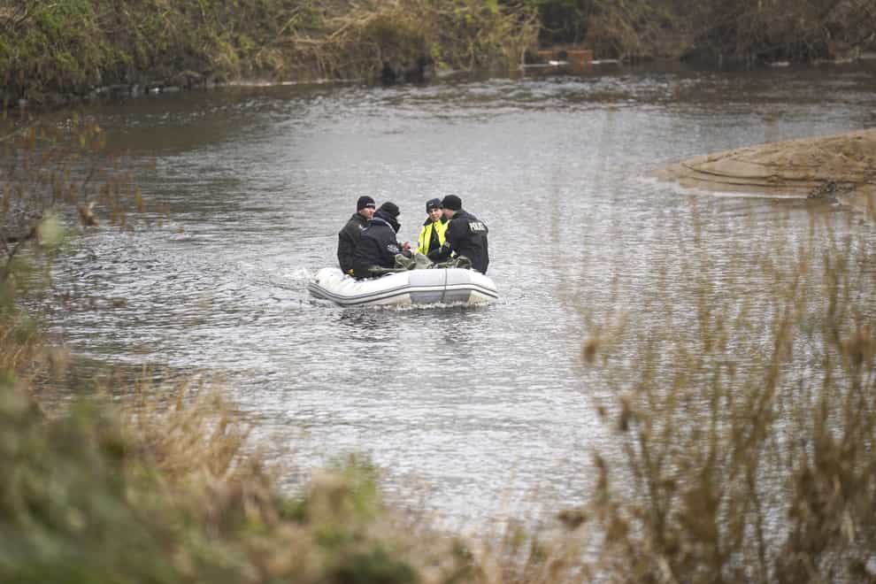 Police officers on the River Wyre, in St Michael’s on Wyre, Lancashire, as police continue their search for missing woman Nicola Bulley (Danny Lawson/PA)