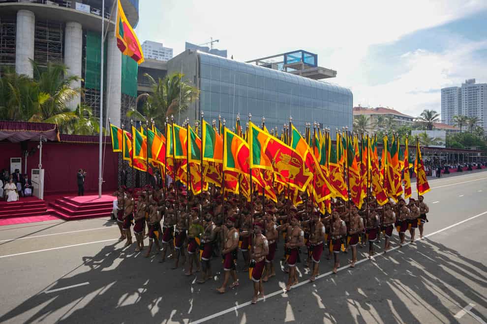 Sri Lankan soldiers march during the Independence Day ceremony in Colombo (Eranga Jayawardena/AP)