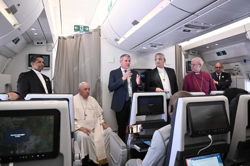 The Archbishop of Canterbury Justin Welby, right, Pope Francis, left, and the Moderator of the General Assembly of the Church of Scotland the Rt Rev Iain Greenshields meet journalists during an airborne press conference aboard the plane directed to Rome, at the end of his pastoral visit to Congo and South Sudan (Tiziana Fabi/Pool Photo Via AP)