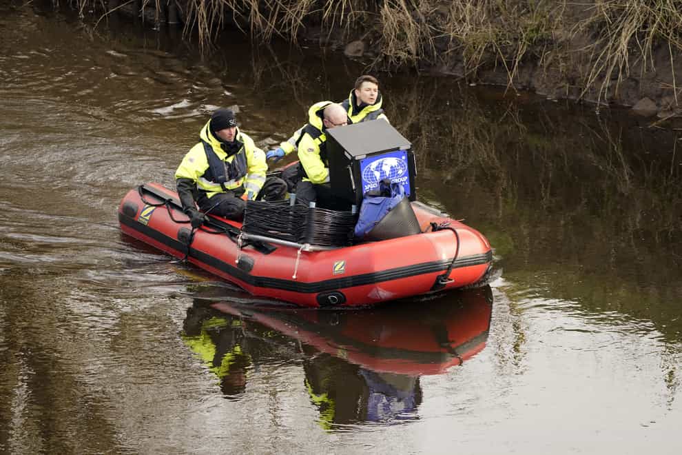 Peter Faulding (centre) chief executive and workers from private underwater search and recovery company, Specialist Group International, using a 18kHz side-scan sonar on the river in St Michael’s on Wyre, Lancashire (Danny Lawson/PA)