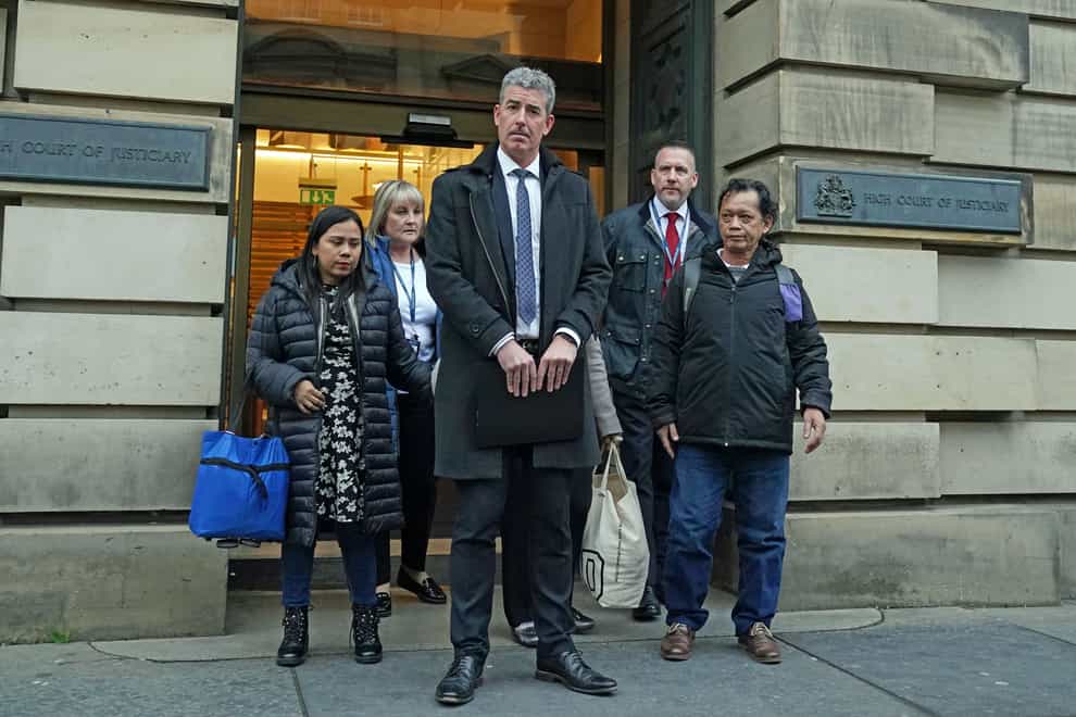 DCI Graham Smith from Police Scotland, outside Edinburgh High Court with the family of Bennylyn Burke (Andrew Milligan/PA)