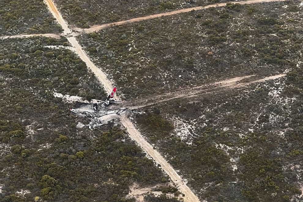 The wreckage of the Boeing 737-3 lies on a road in remote countryside in Western Australia (DFES via AP)