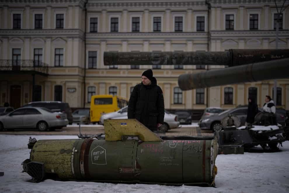 A man looks at the remains of a Russian missile displayed in central Kyiv, Ukraine (Daniel Cole/AP)