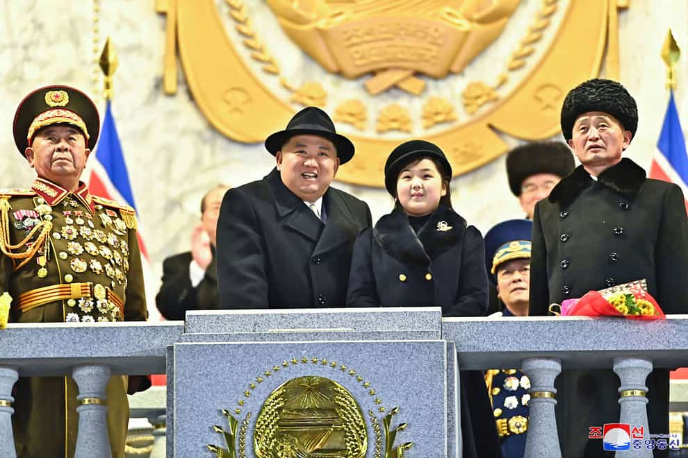 North Korean leader Kim Jong Un, centre left, with his daughter attends a military parade to mark the 75th founding anniversary of the Korean People’s Army (Korean Central News Agency/Korea News Service/AP)