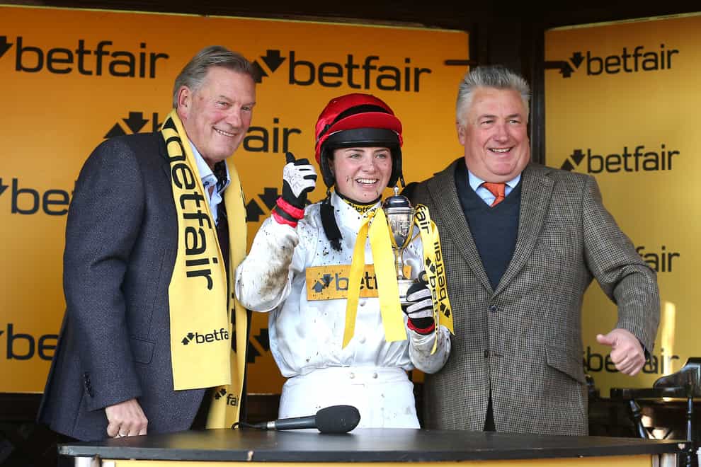 Jockey Bryony Frost (centre) with former England manager Glenn Hoddle (left) and trainer Paul Nicholls after winning the Betfair Race To The World Cup Stakes with horse England on Betfair Chase Day at Haydock Park Racecourse, Newton-le-Willows. Picture date: Saturday November 19, 2022.