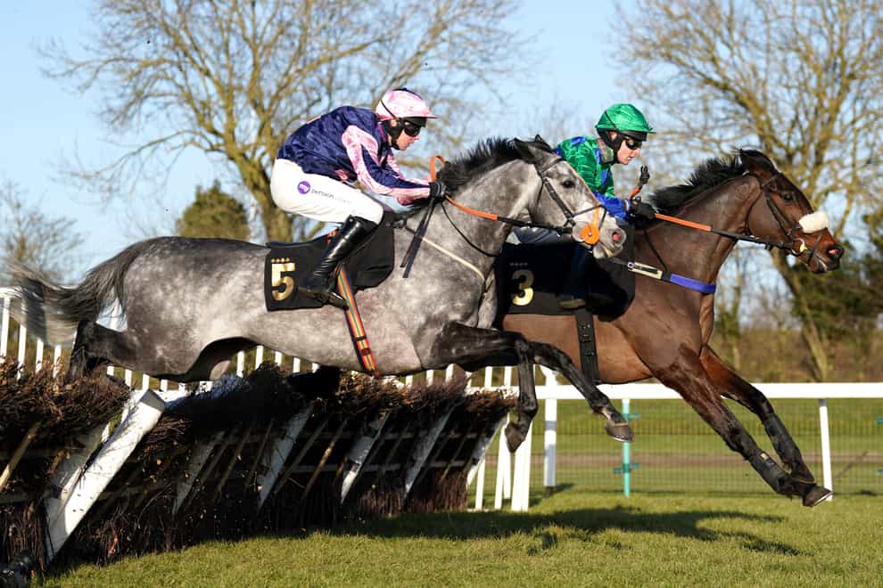 Marble Sands ridden by jockey Kielan Woods (left) on their way to winning the M1 Agency Sidney Banks Memorial Novices’ Hurdle with Ginny’s Destiny ridden by jockey Stan Sheppard third at Huntingdon Racecourse, Cambridgeshire (Tim Goode/PA)