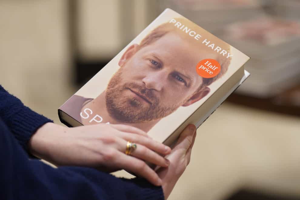A person holds a copy of the newly released autobiography from the Duke of Sussex, titled Spare, at Waterstones Piccadilly, London (James Manning/PA)