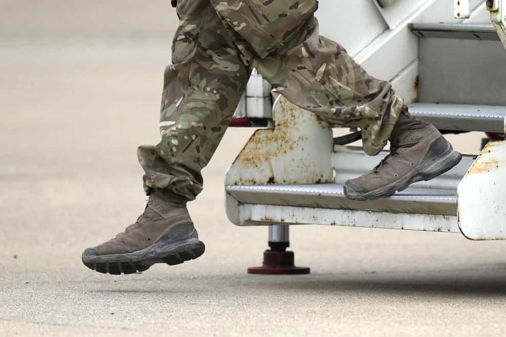 A member of the British armed forces 16 Air Assault Brigade disembarks a RAF Voyager aircraft after landing at RAF Brize Norton, Oxfordshire, following their return from helping in operations to evacuate people from Kabul airport in Afghanistan (Alastair Grant/PA)