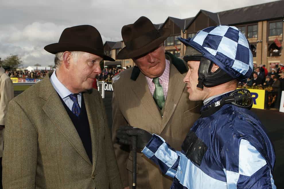Jockey Richard Johnson (right) chats to trainer Philip Hobbs (left) after winning the Ryanair Novice Chase on Captain Chris at Punchestown in 2011 (Julien Behal/PA)
