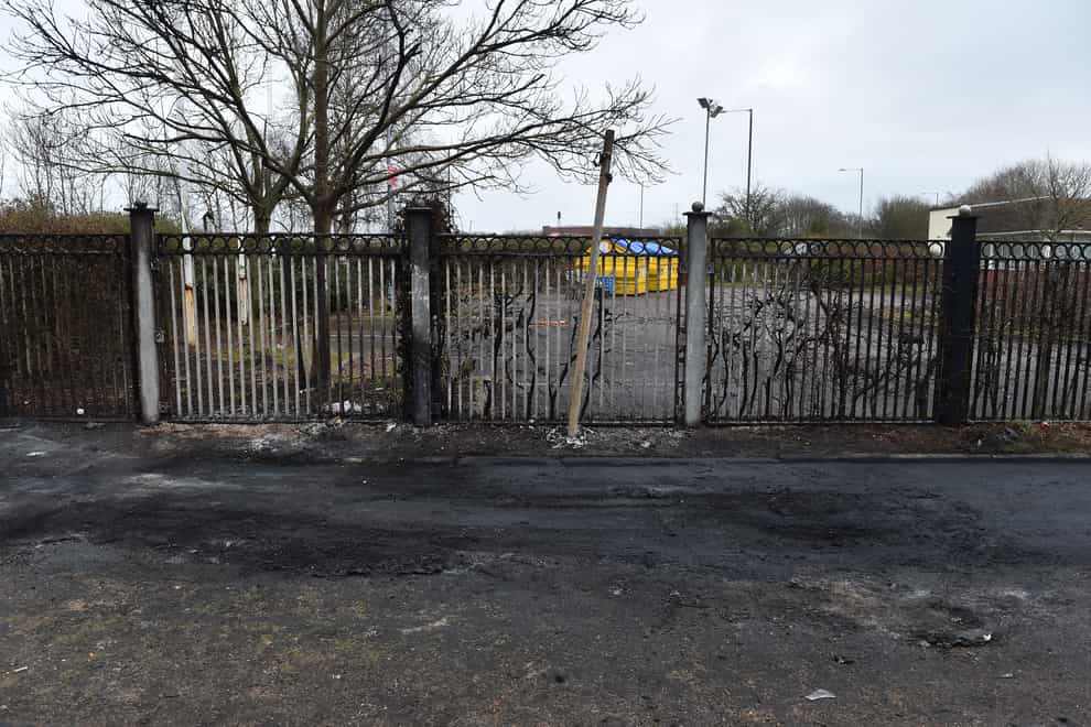 The scene where a police vehicle was set alight outside the Suites Hotel in Knowsley, Merseyside (Peter Powell/PA)