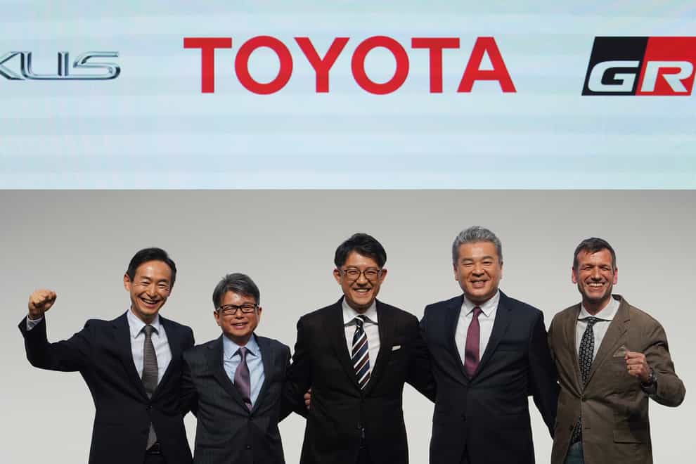 New Toyota chief executive Koji Sato (centre) with his new management team (Eugene Hoshiko/AP)