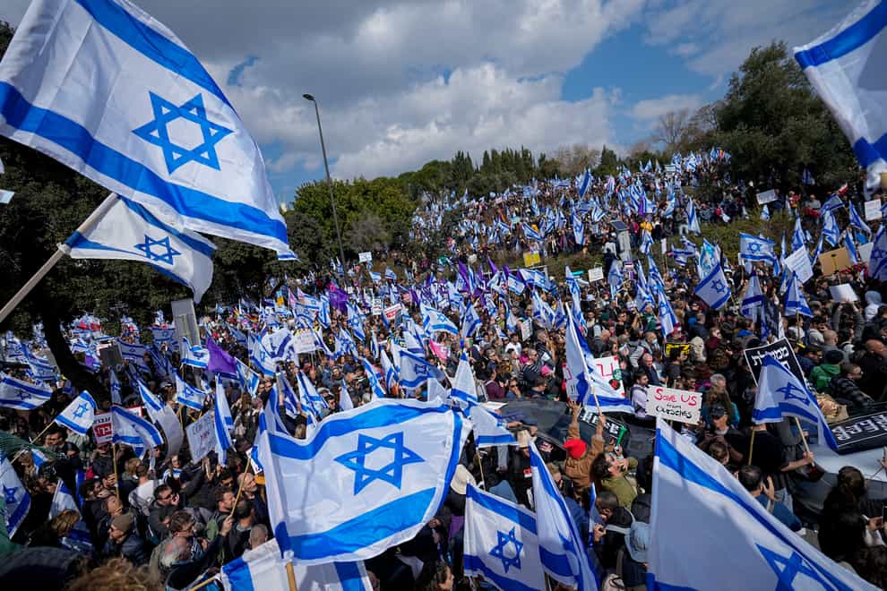Israelis protest outside the Knesset against plans by Prime Minister Benjamin Netanyahu’s new government to overhaul the judicial system,(Ohad Zwigenberg/AP)