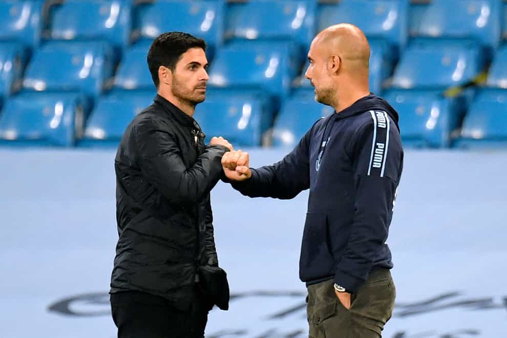 Manchester City manager Pep Guardiola (right) embraces Arsenal manager Mikel Arteta before their recent FA Cup clash (Peter Powell/NMC Pool/PA)
