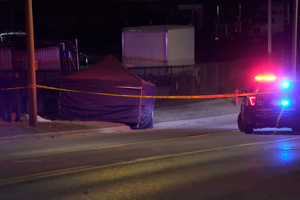 A tent covers the body of the alleged gunman (Carlos Osorio/AP)