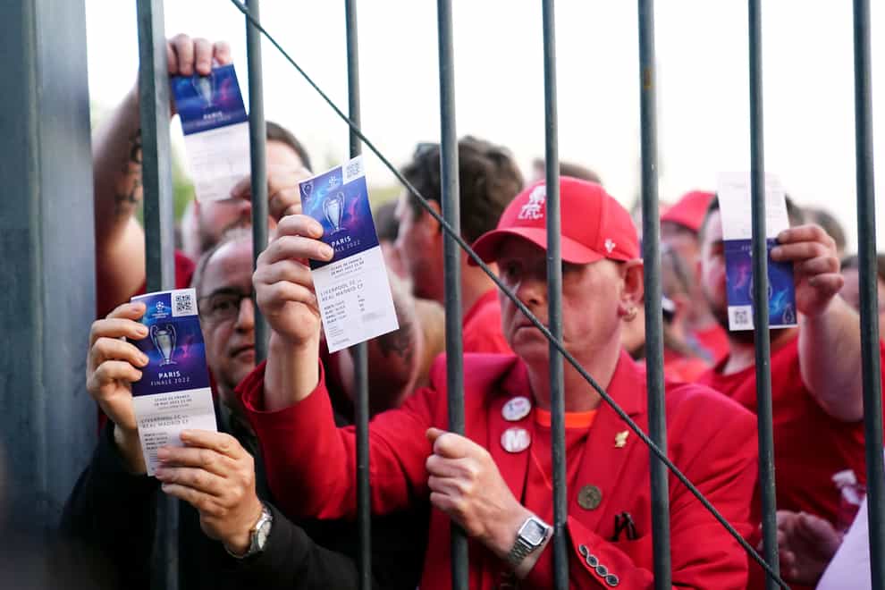 Liverpool fans show their Champions League final tickets (Adam Davy/PA)