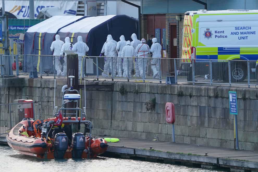 Police forensic officers at the RNLI station at the Port of Dover after a large search and rescue operation in the Channel off the coast of Dungeness, in Kent, following an incident involving a small boat likely to have been carrying migrants in December (Gareth Fuller/PA)